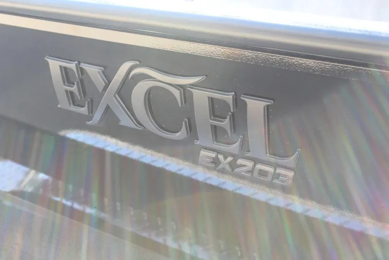 Slide: The Image of Excel EX 203 logo on metallic surface, 2026 model with light reflections. - 11