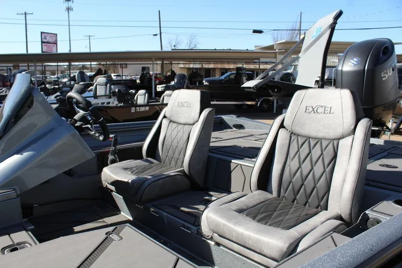 Slide: The Image of 2026 Excel EX 203 boat interior with plush seating and modern design. - 12