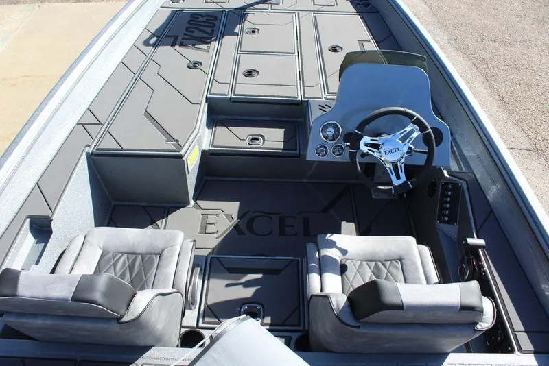 Slide: The Image of 2026 Excel EX 203 boat interior with dual seats and modern steering console. - 14