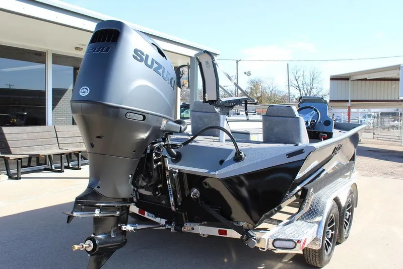 Slide: The Image of 2026 Excel EX 203 boat with Suzuki outboard motor on a trailer. - 3