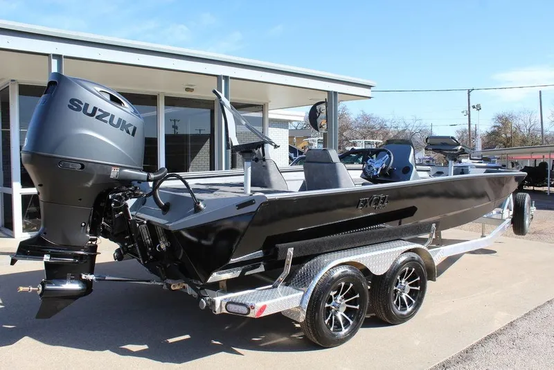 Slide: The Image of 2026 Excel EX 203 boat with Suzuki outboard motor on a trailer. - 4