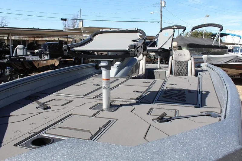 Slide: The Image of 2026 Excel EX 203 boat interior with seating and storage compartments. - 8