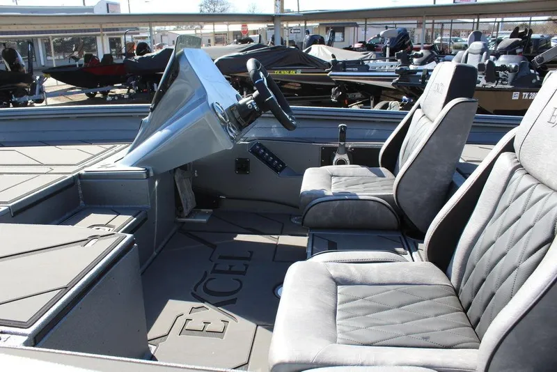 Slide: The Image of 2026 Excel EX 203 boat interior with modern seating and steering console. - 9