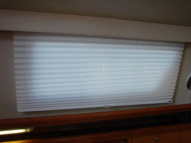 Slide: The Image of Interior of 2007 Hunter 44 Deck Salon with blind closed for privacy. - 52