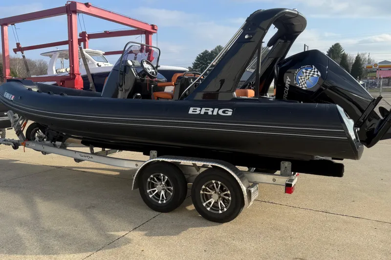 Slide: The Image of 2019 Brig Eagle 650 boat on trailer, black exterior, parked outdoors. - 4