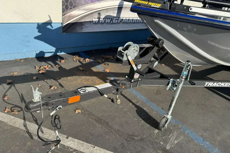 Slide: The Image of 2017 Tracker Pro Team 175 TF boat trailer hitch and winch in parking lot. - 3