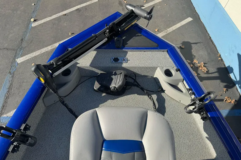Slide: The Image of 2017 Tracker Pro Team 175 TF boat interior with trolling motor and seating. - 7