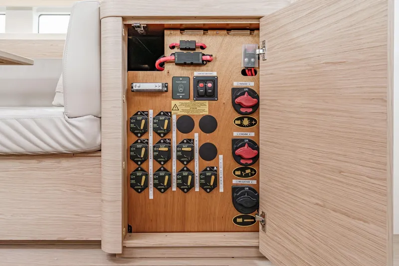 Slide: The Image of Electrical panel inside 2022 Beneteau Oceanis Yacht 54, showcasing switches and controls. - 29