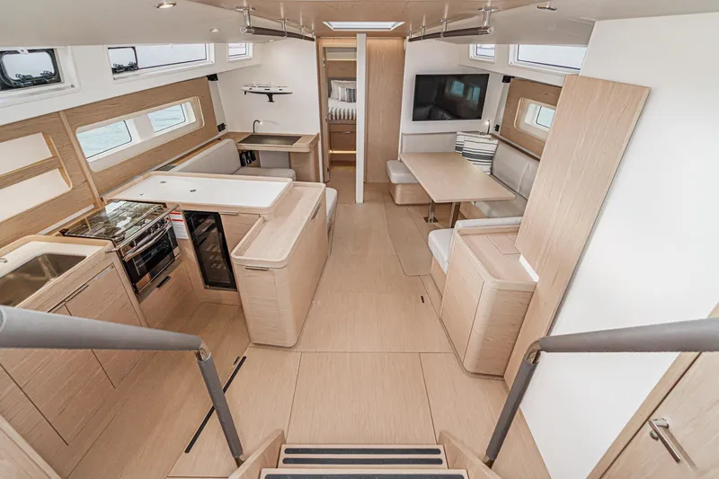 Slide: The Image of Luxurious interior of 2022 Beneteau Oceanis Yacht 54 with modern kitchen and dining area. - 3