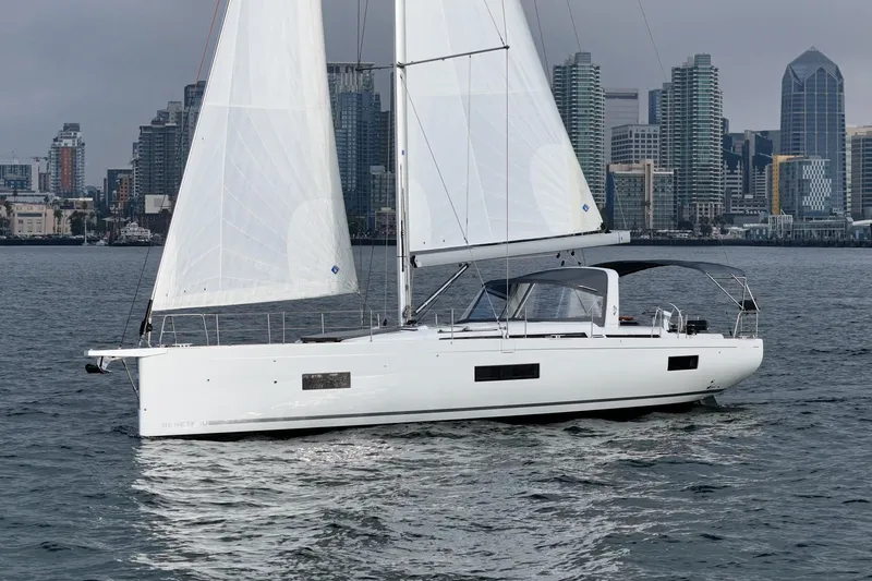 Slide: The Image of 2022 Beneteau Oceanis Yacht 54 sailing near city skyline. - 32