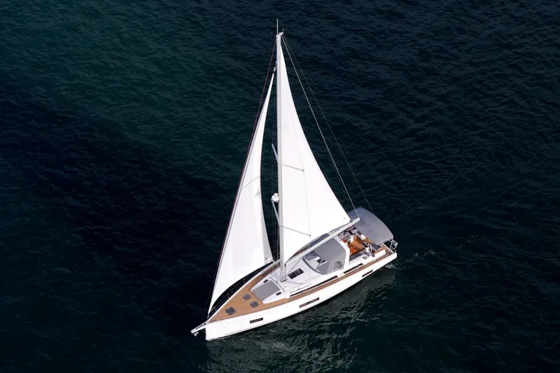 Slide: The Image of 2022 Beneteau Oceanis Yacht 54 sailing on open water, aerial view. - 35