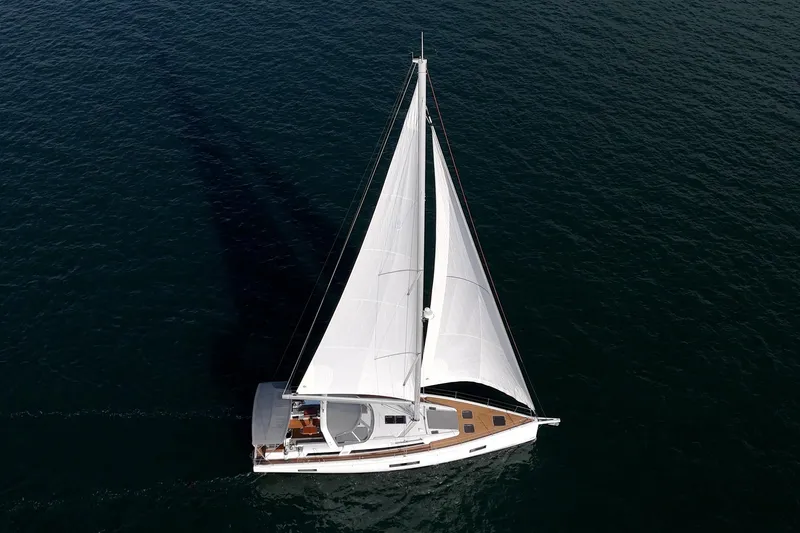 Slide: The Image of 2022 Beneteau Oceanis Yacht 54 sailing on open water, aerial view. - 36
