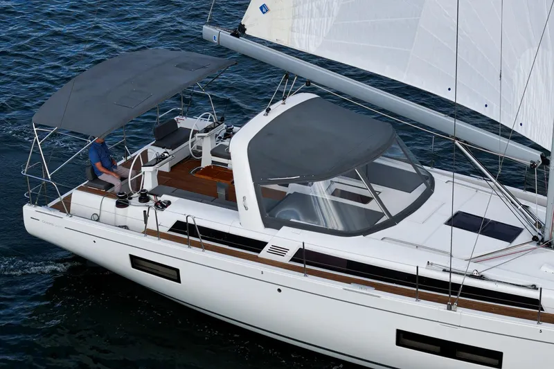 Slide: The Image of 2022 Beneteau Oceanis Yacht 54 sailing on open water, featuring sleek design and spacious deck. - 42