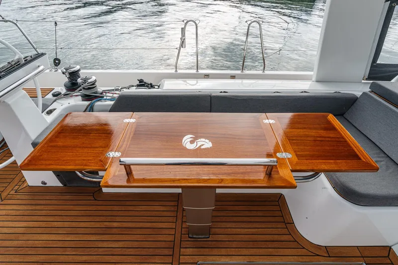 Slide: The Image of Luxurious teak deck and table on 2022 Beneteau Oceanis Yacht 54. - 69
