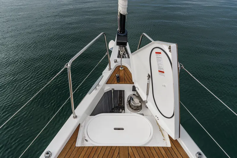 Slide: The Image of Bow view of 2022 Beneteau Oceanis Yacht 54 with open hatch and teak deck. - 75