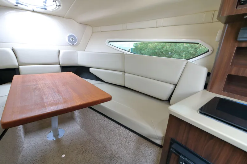 Slide: The Image of 2018 Regal 26 Express cabin interior with seating and table. - 22