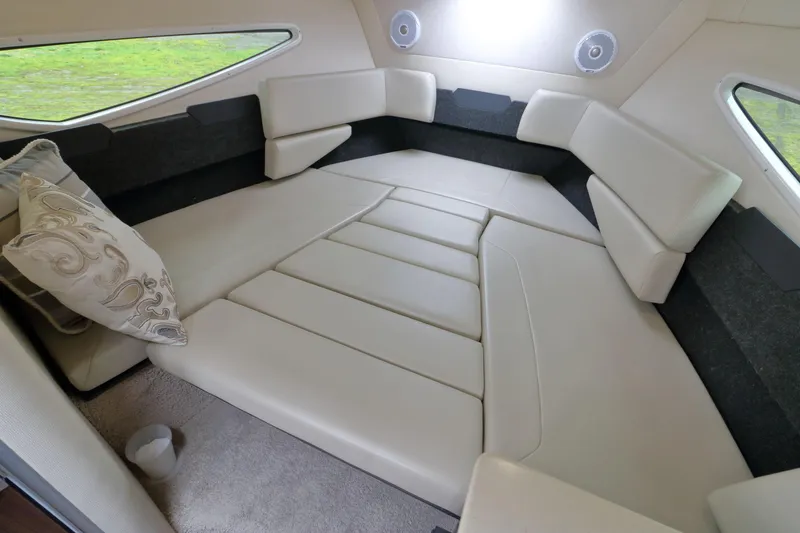 Slide: The Image of Interior of 2018 Regal 26 Express with beige upholstery. - 24