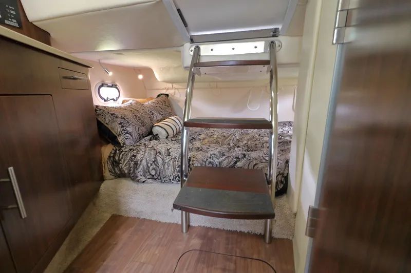 Slide: The Image of Interior of 2018 Regal 26 Express with bed and ladder. - 25