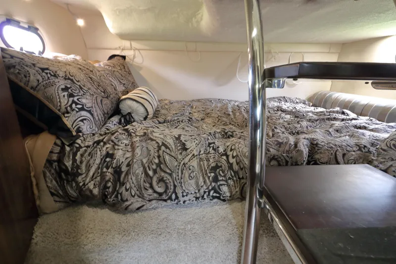 Slide: The Image of Interior of 2018 Regal 26 Express with cozy bed. - 26