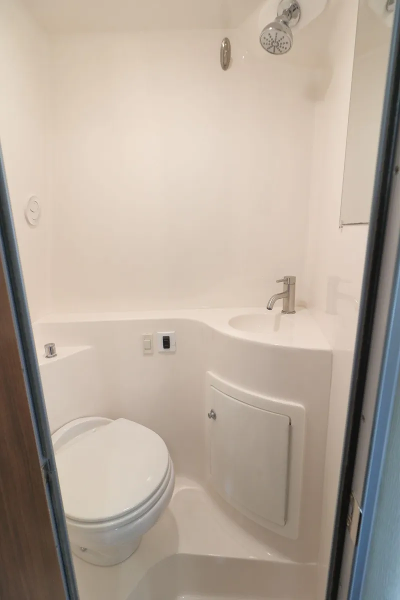 Slide: The Image of Compact bathroom in 2018 Regal 26 Express boat. - 27