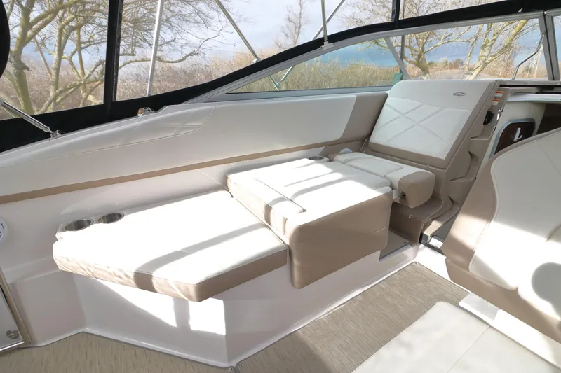 Slide: The Image of Interior of 2018 Regal 26 Express with beige seating area. - 31