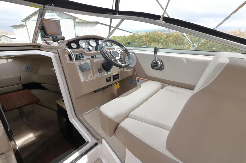Slide: The Image of Interior of a 2018 Regal 26 Express boat with helm station. - 33
