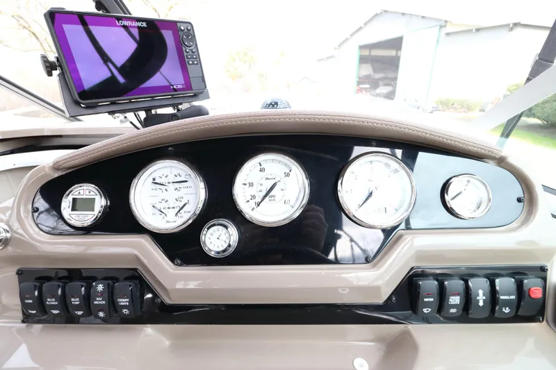 Slide: The Image of Dashboard of a 2018 Regal 26 Express boat with instruments. - 35