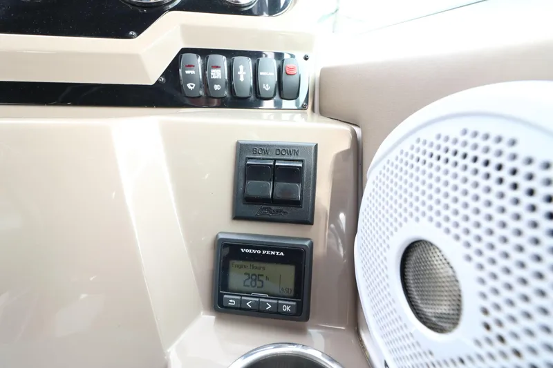 Slide: The Image of 2018 Regal 26 Express dashboard with controls and speaker. - 36