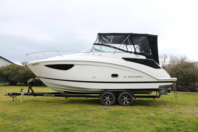 Slide: The Image of 2018 Regal 26 Express boat on trailer, side view. - 4