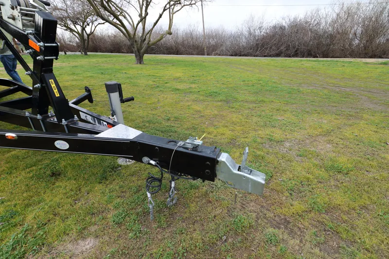 Slide: The Image of 2018 Regal 26 Express trailer hitch on grassy field. - 7