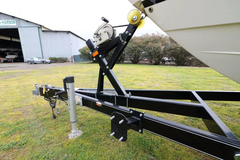 Slide: The Image of Boat trailer for 2018 Regal 26 Express on grassy area. - 8