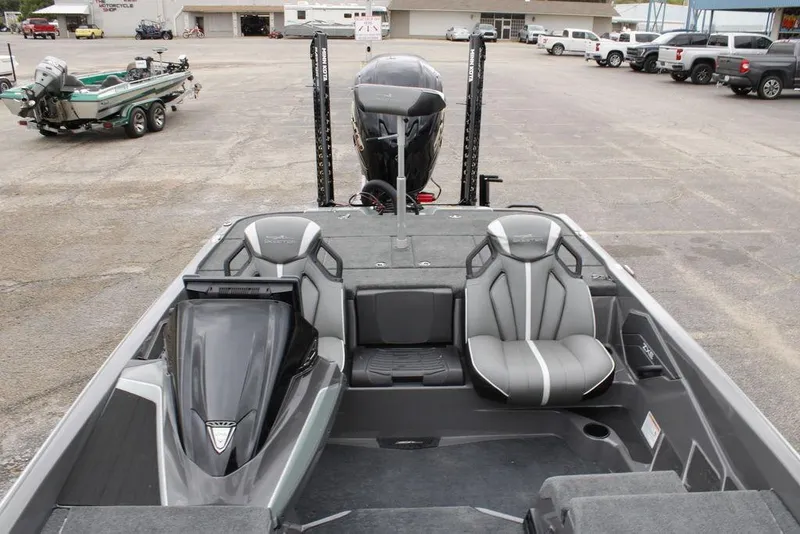 Slide: The Image of 2026 Skeeter ZXE21 boat interior with sleek seating and modern design in a parking lot. - 11