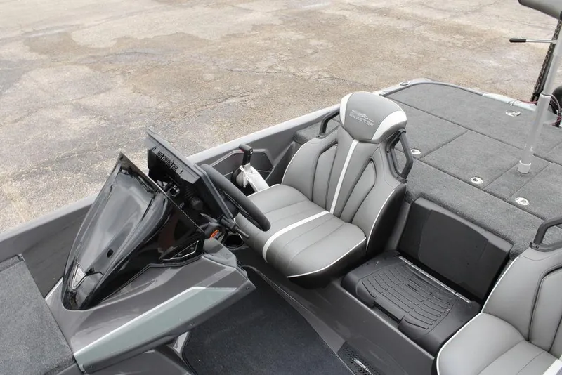 Slide: The Image of 2026 Skeeter ZXE21 boat interior with sleek gray seating and modern dashboard. - 12