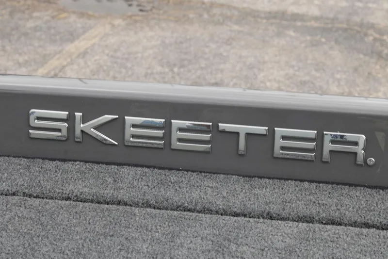 Slide: The Image of 2026 Skeeter ZXE21 logo on gray surface, close-up view. - 14