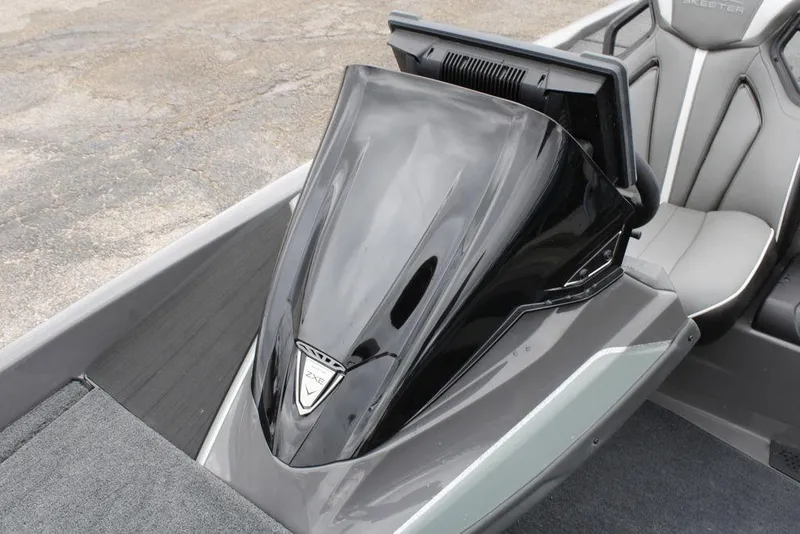 Slide: The Image of 2026 Skeeter ZXE21 boat interior with sleek black console and modern seating. - 16