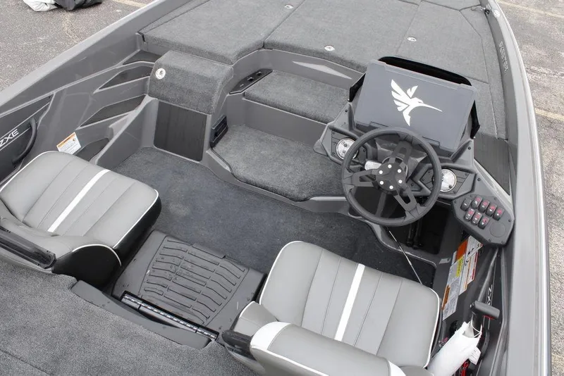 Slide: The Image of 2026 Skeeter ZXE21 boat interior with steering wheel and seating. - 21