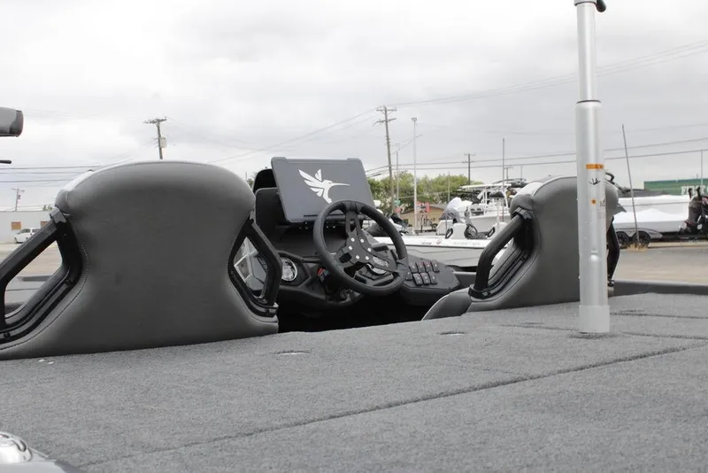 Slide: The Image of 2026 Skeeter ZXE21 boat interior with steering wheel and dashboard, showcasing modern design. - 3