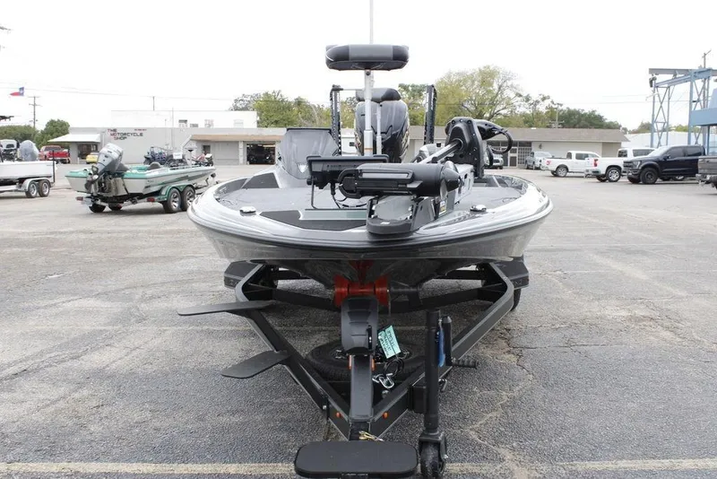 Slide: The Image of 2026 Skeeter ZXE21 boat on trailer in parking lot, front view. - 5