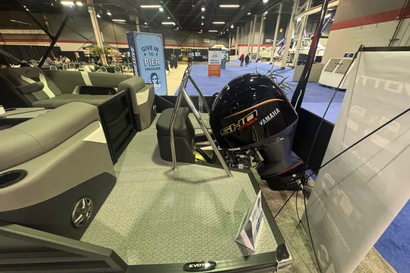 Slide: The Image of 2026 Evotti 521QL boat with Yamaha engine displayed at an indoor exhibition. - 12