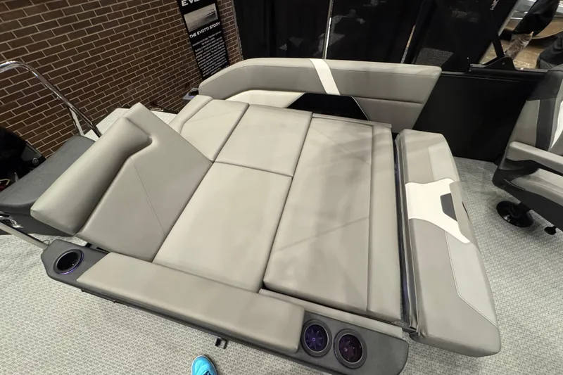 Slide: The Image of Evotti 523CS 2026 model luxury boat seating with integrated cup holders, showcased indoors. - 10