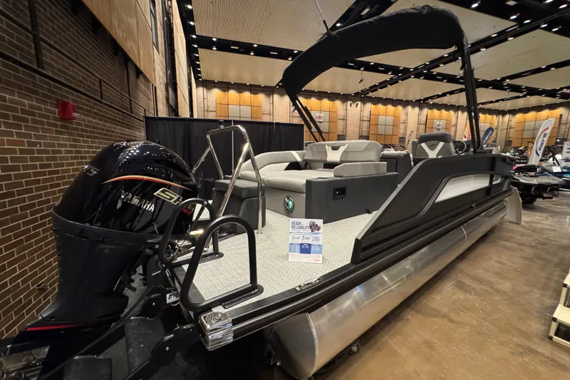 Slide: The Image of 2026 Evotti 523CS pontoon boat with Yamaha engine on display indoors. - 13