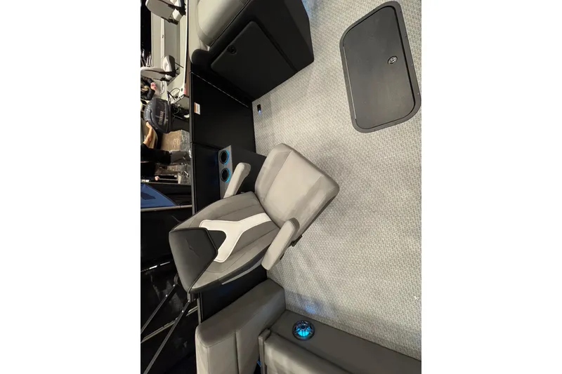 Slide: The Image of Evotti 523CS 2026 boat interior with modern seating and cup holders. - 7