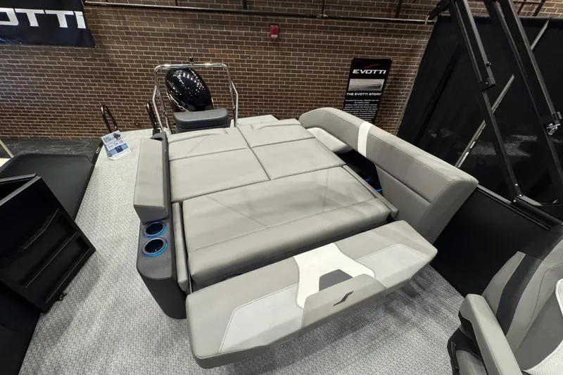 Slide: The Image of 2026 Evotti 523CS boat interior with gray seating and cup holders. - 9