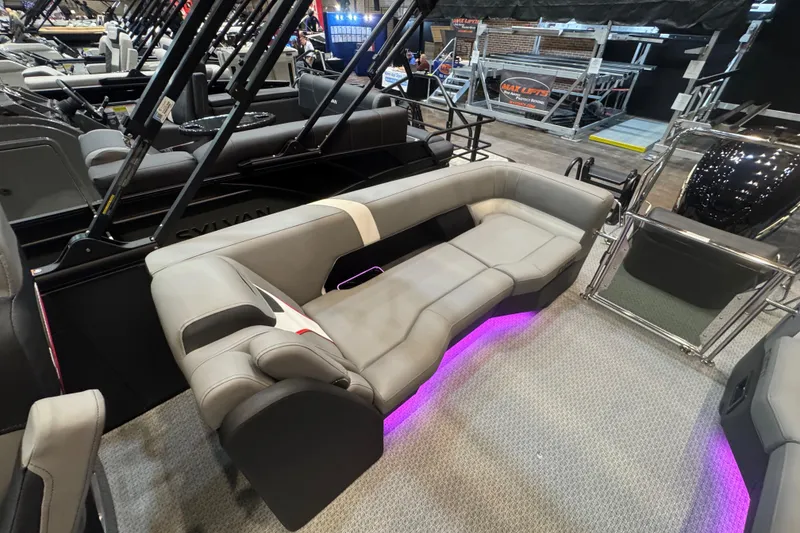 Slide: The Image of Luxurious Evotti 725QL boat interior with plush seating and ambient purple lighting, 2026 model. - 11