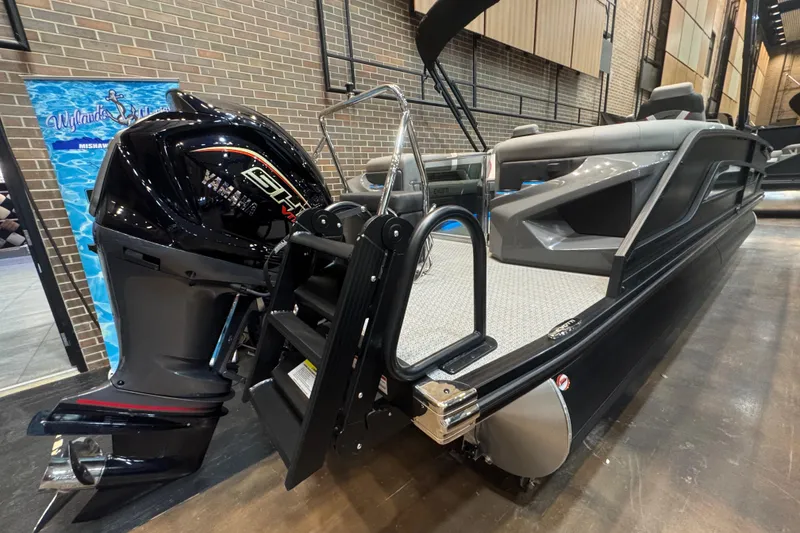 Slide: The Image of 2026 Evotti 725QL boat with Yamaha engine, displayed indoors on a showroom floor. - 14