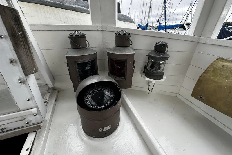 Slide: The Image of Vintage nautical instruments on a 2005 custom sail-assisted trawler deck. - 29