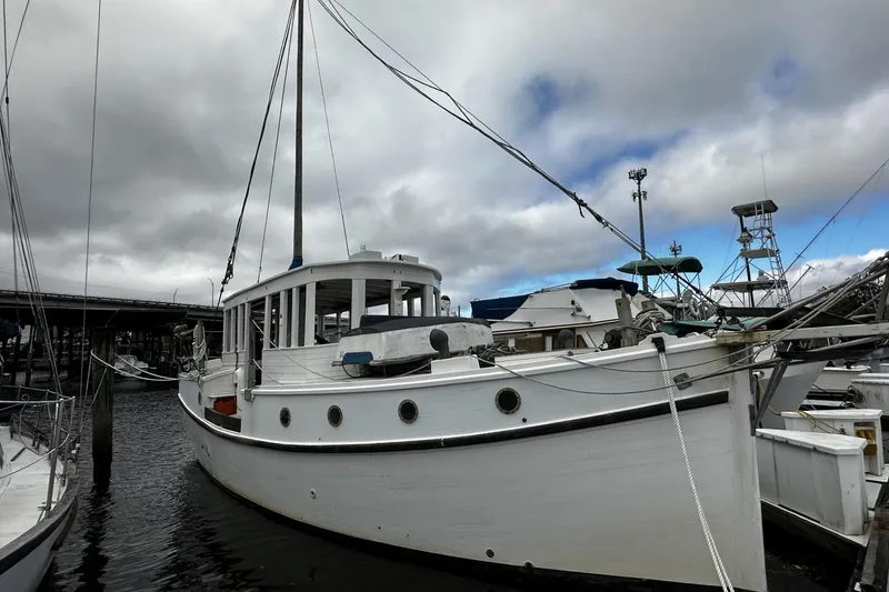 Slide: The Image of Custom 2005 sail-assisted trawler docked under cloudy skies. - 3