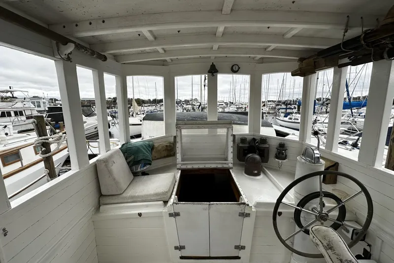 Slide: The Image of Interior of a 2005 Custom Sail-Assisted Trawler in a marina setting. - 4
