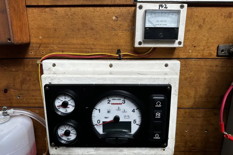 Slide: The Image of Control panel of a 2005 Custom Sail-Assisted Trawler with gauges and voltmeter. - 47