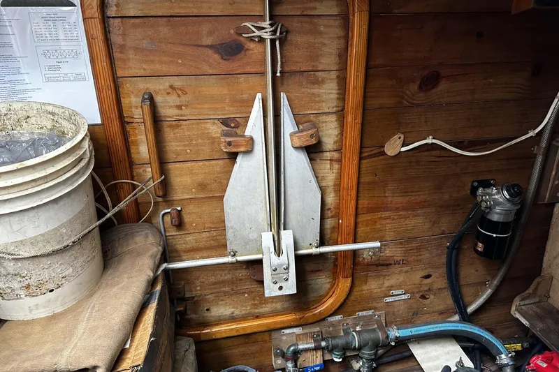 Slide: The Image of Wooden interior of a 2005 custom sail-assisted trawler with nautical equipment and tools. - 57